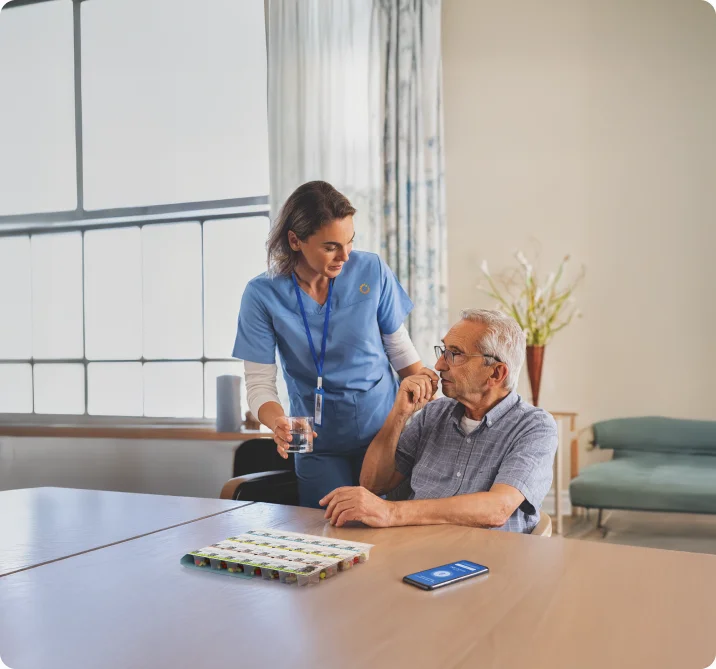 Caregiver assisting a senior resident